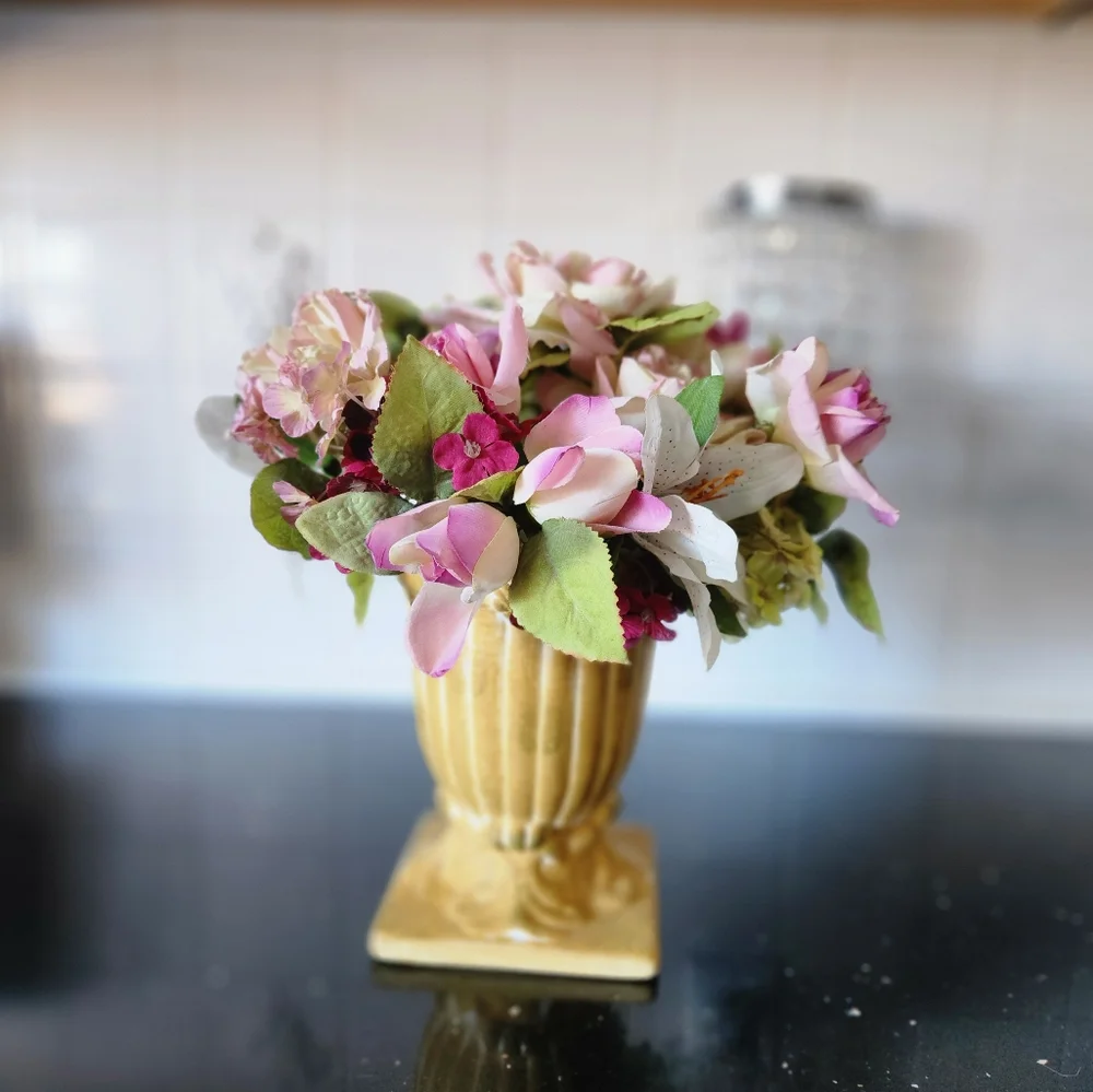 Beautiful faux flowers in vase